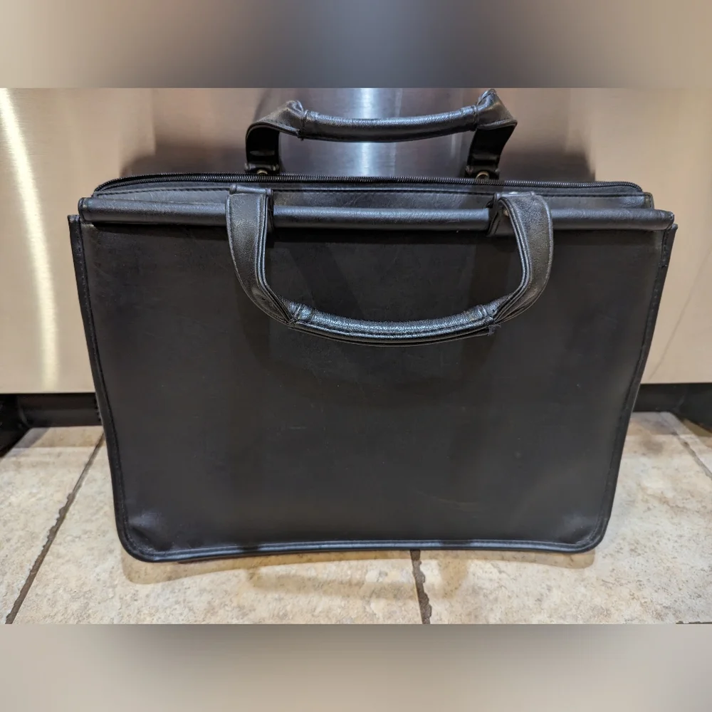 Solo brand black leather briefcase new never used. Missing shoulder strap.